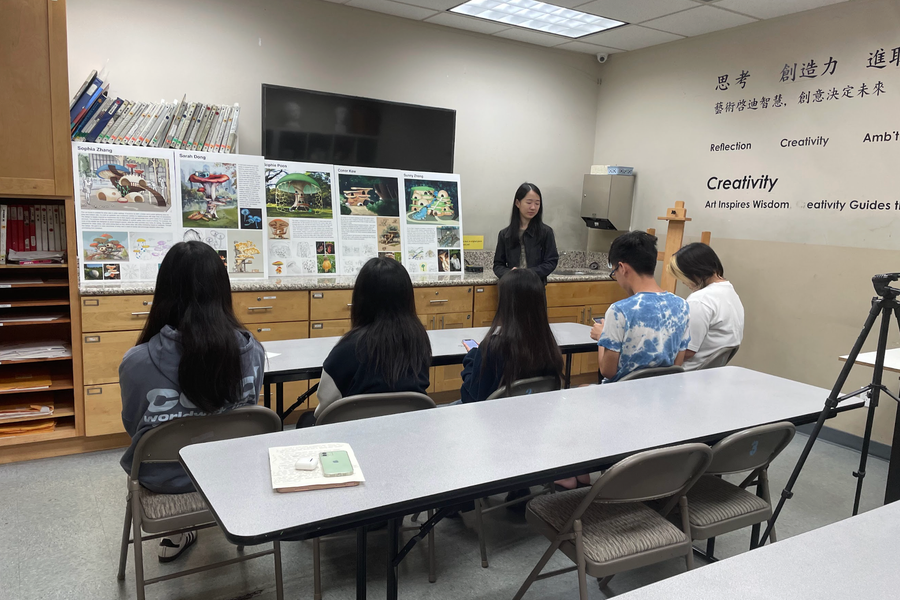 Student portfolio review with instructor